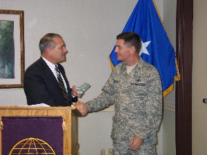 Maj. Gen. John Urias, USA (Ret.), presents Brig. Gen. Gary Connor, USAF, with a token of appreciation from the chapter for his guest presentation at the August meeting.